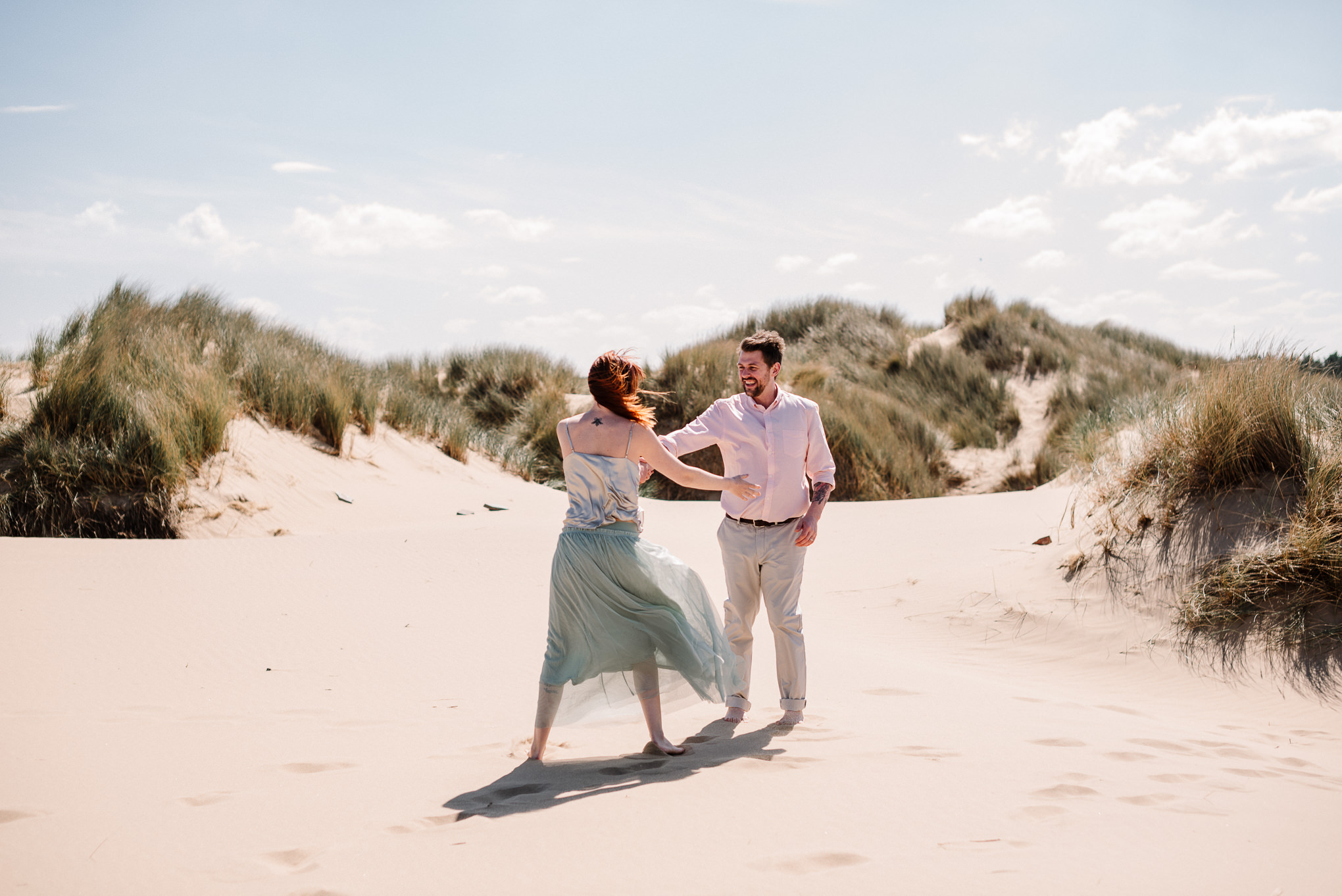 Alternative bride and groom on the beach at Formby