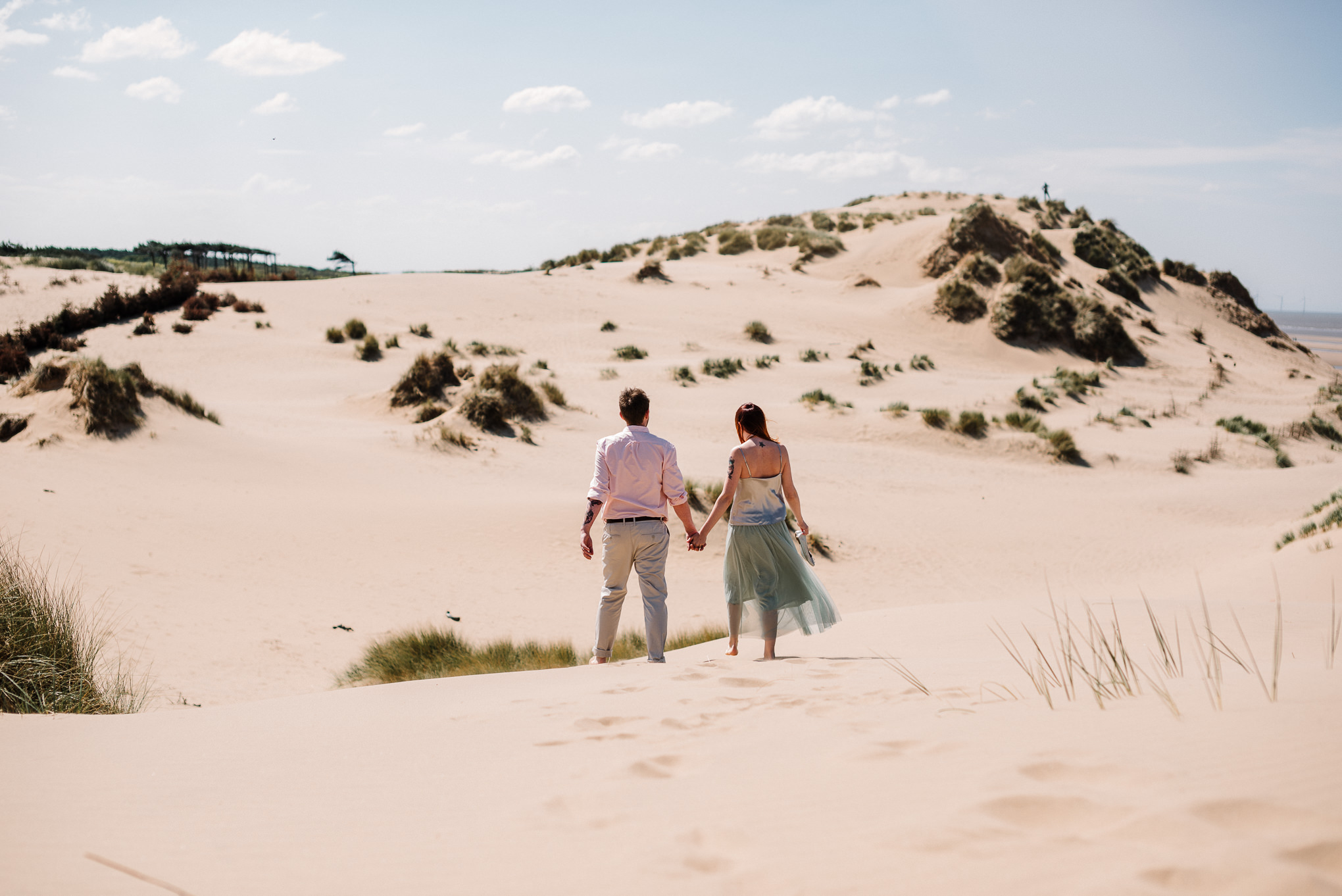 Walking along the beach. Liverpool wedding photography