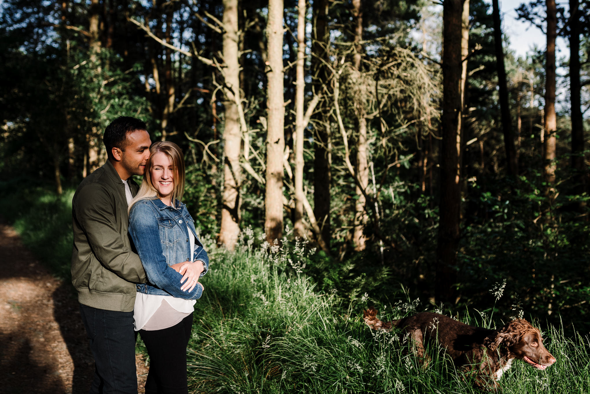 couple stood together in the woods. Bolton photographer