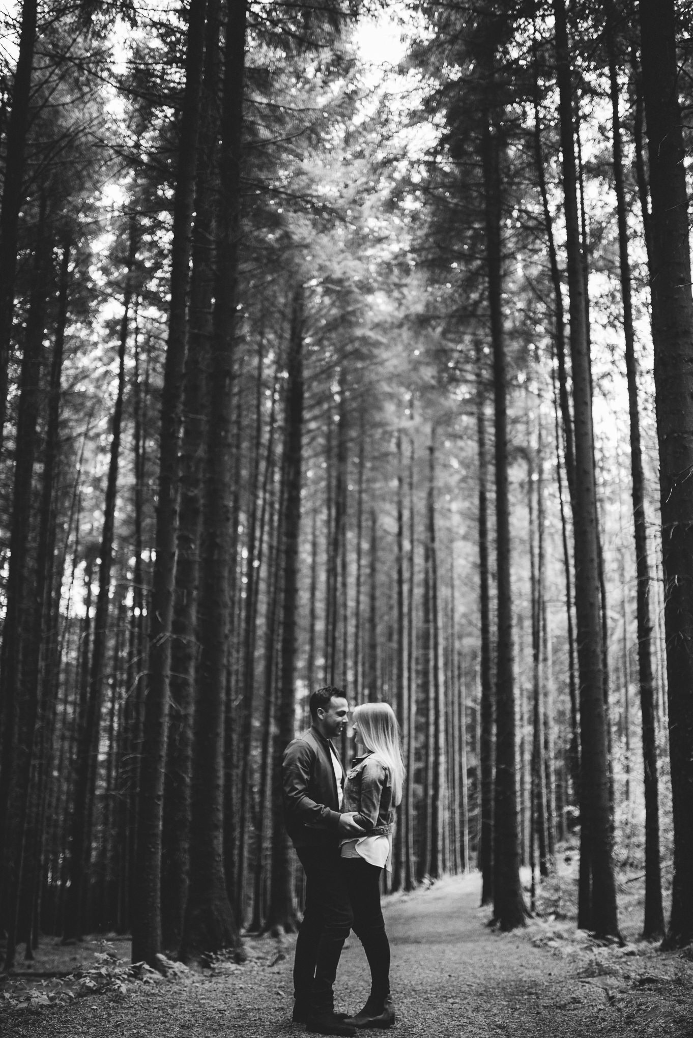 Stood together on a path in between tall trees. Lancashire lifestyle photography 