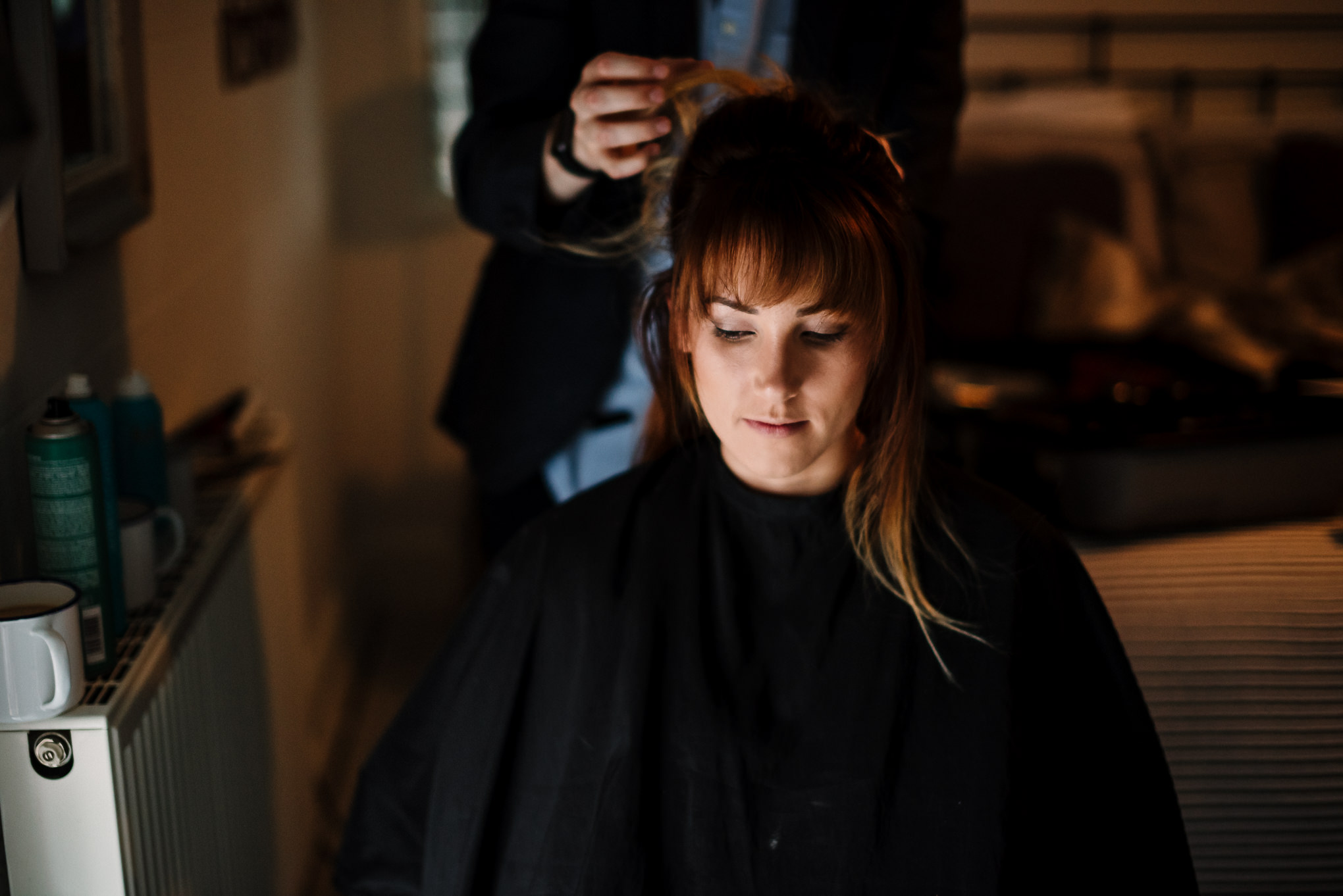 Bridesmaid getting hair put up