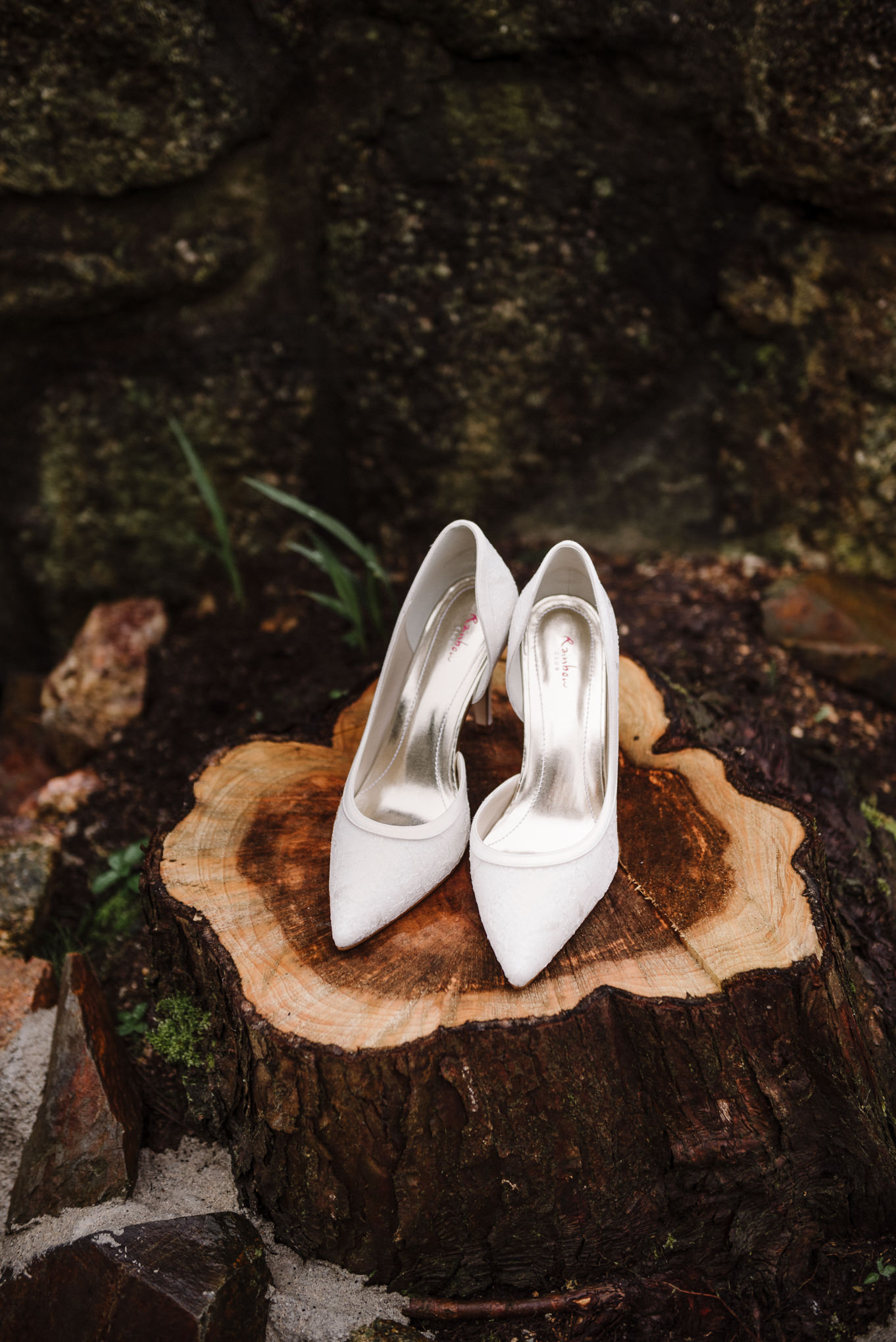 Brides shoes on a log outside of the Dreamcatcher in Cornwall 