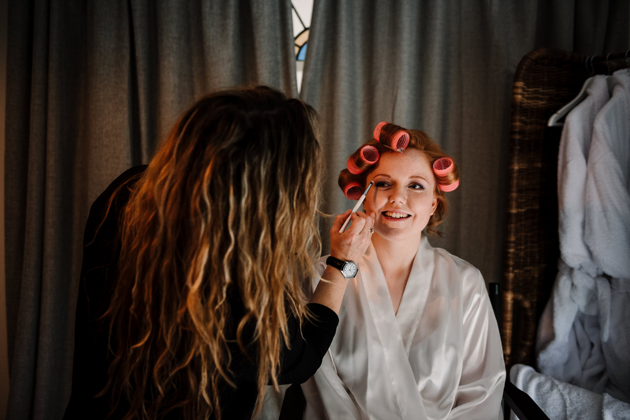 Bride having her makeup done on the morning of the wedding. 