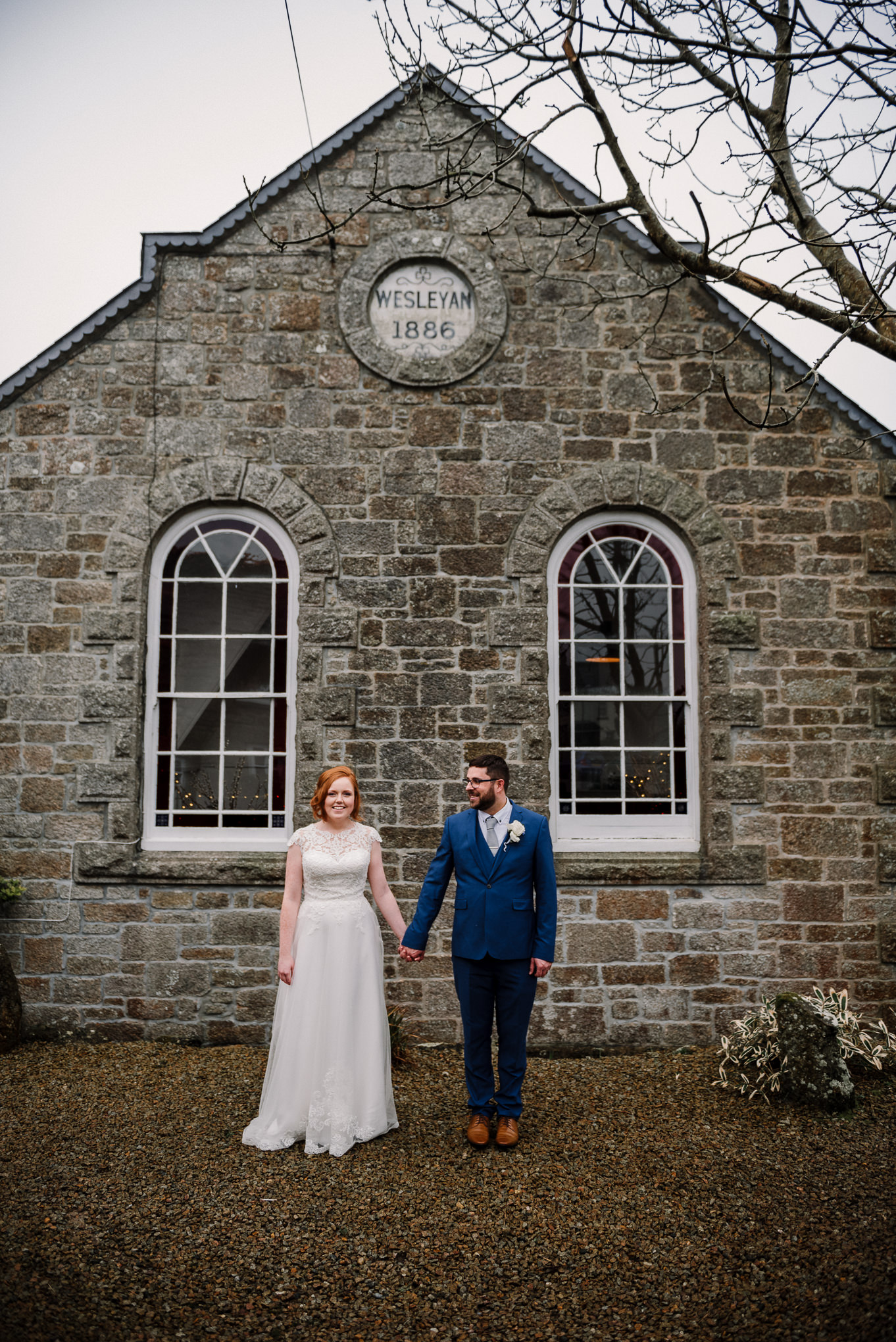 Bride and groom stood together outside the Dreamcatcher Wedding Venue in Cornwall. Elopement wedding photography.