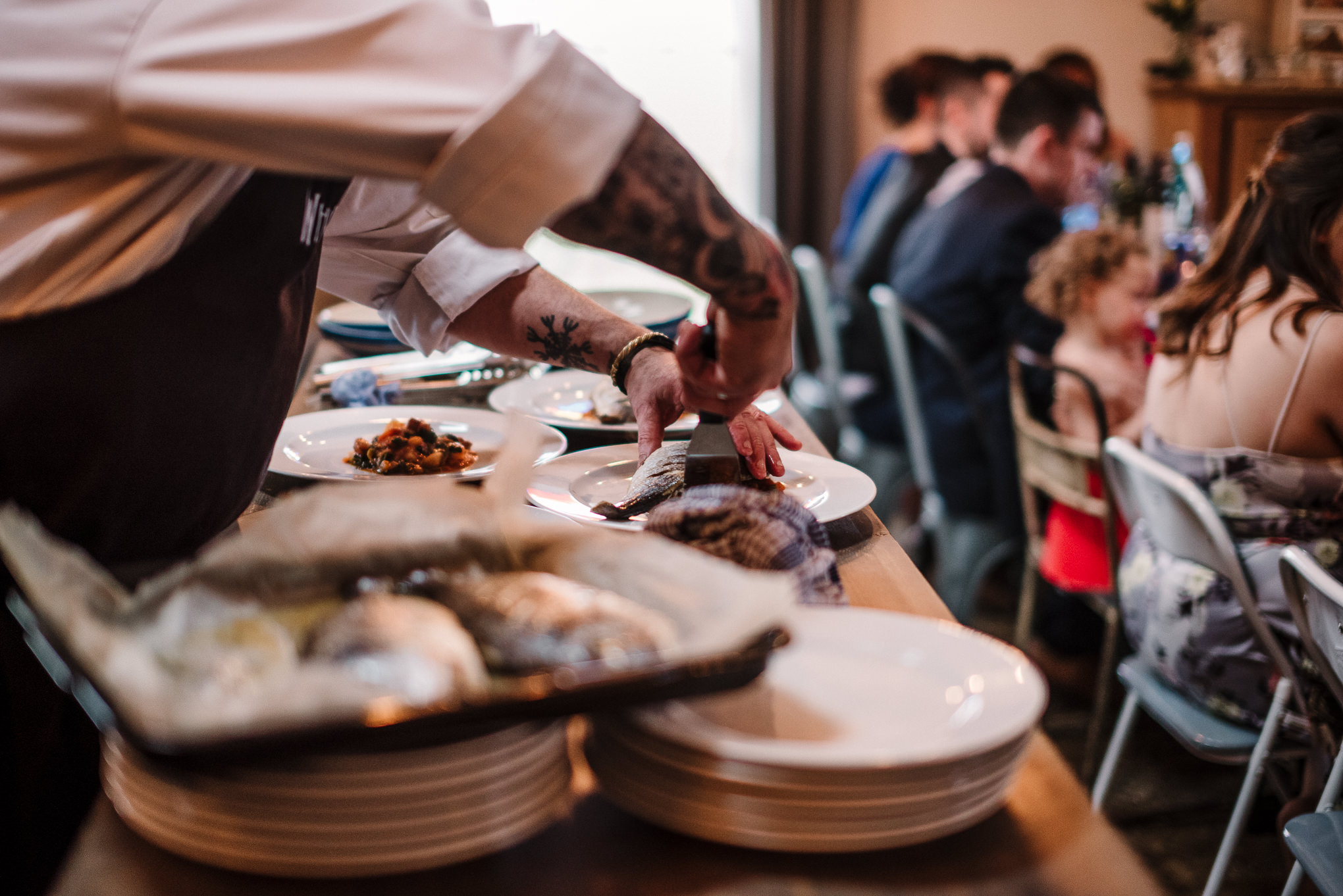 Documentary shot of meal prep durning wedding breakfast.