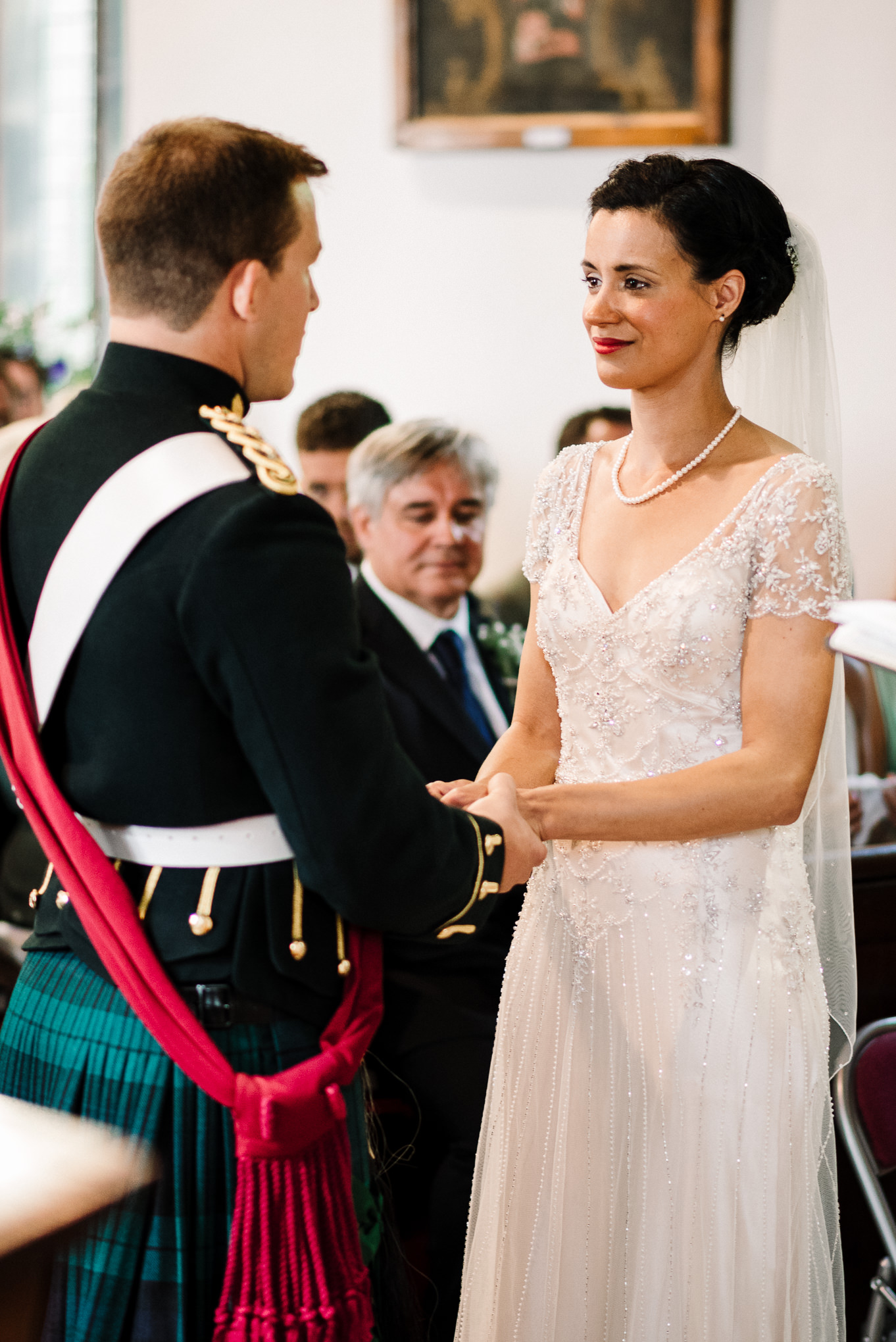 Bride and groom looking at one another during the wedding ceremony