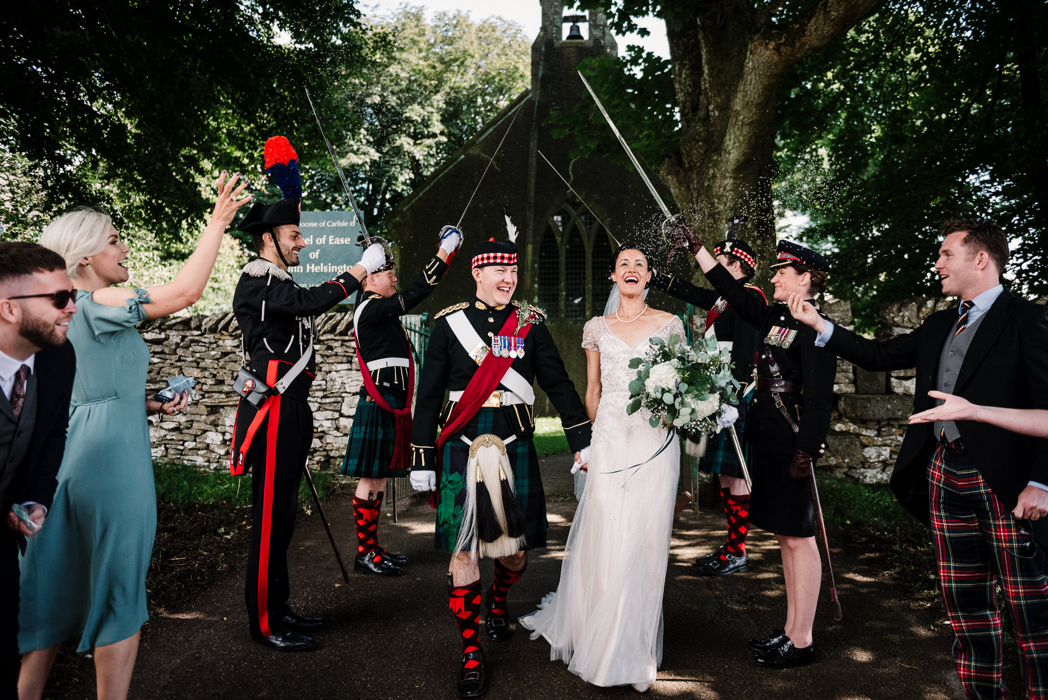 Bride and groom leaving church to guard of honour