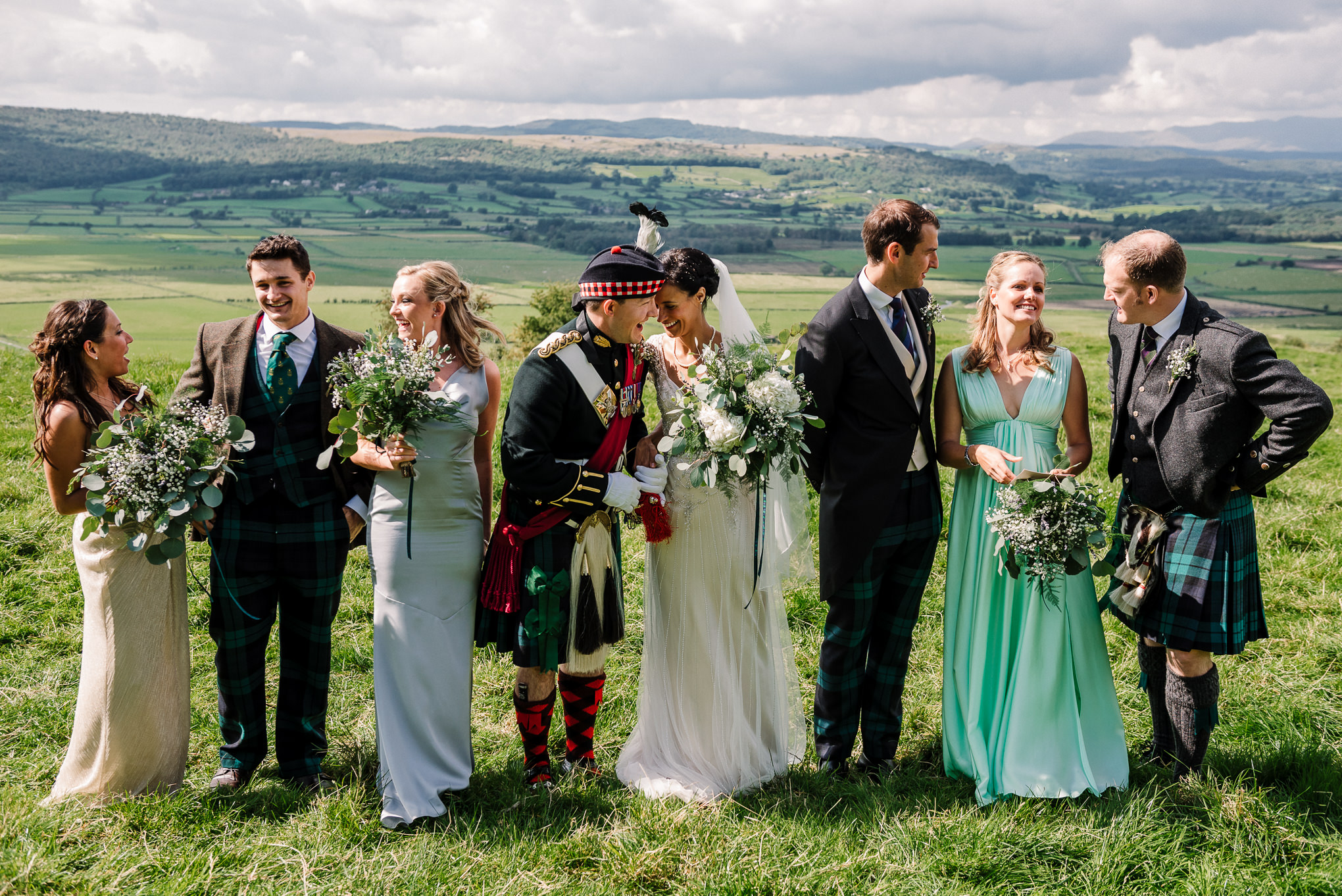 Natural photo of bridal party on the hillside. Lake district wedding photography