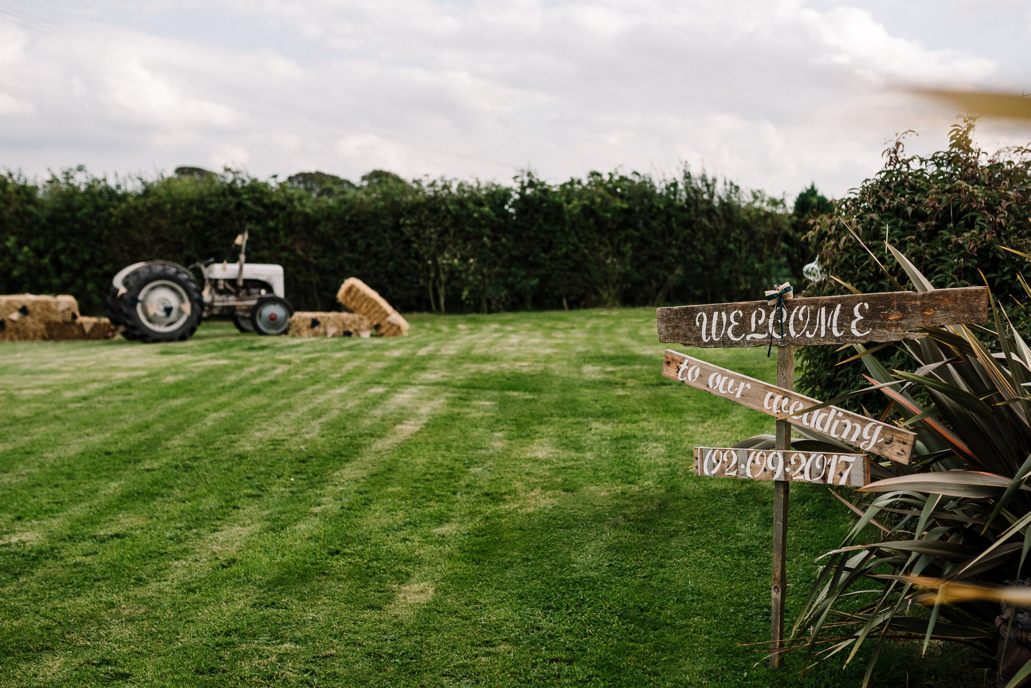 Tractor and rustic wood sign on the farm