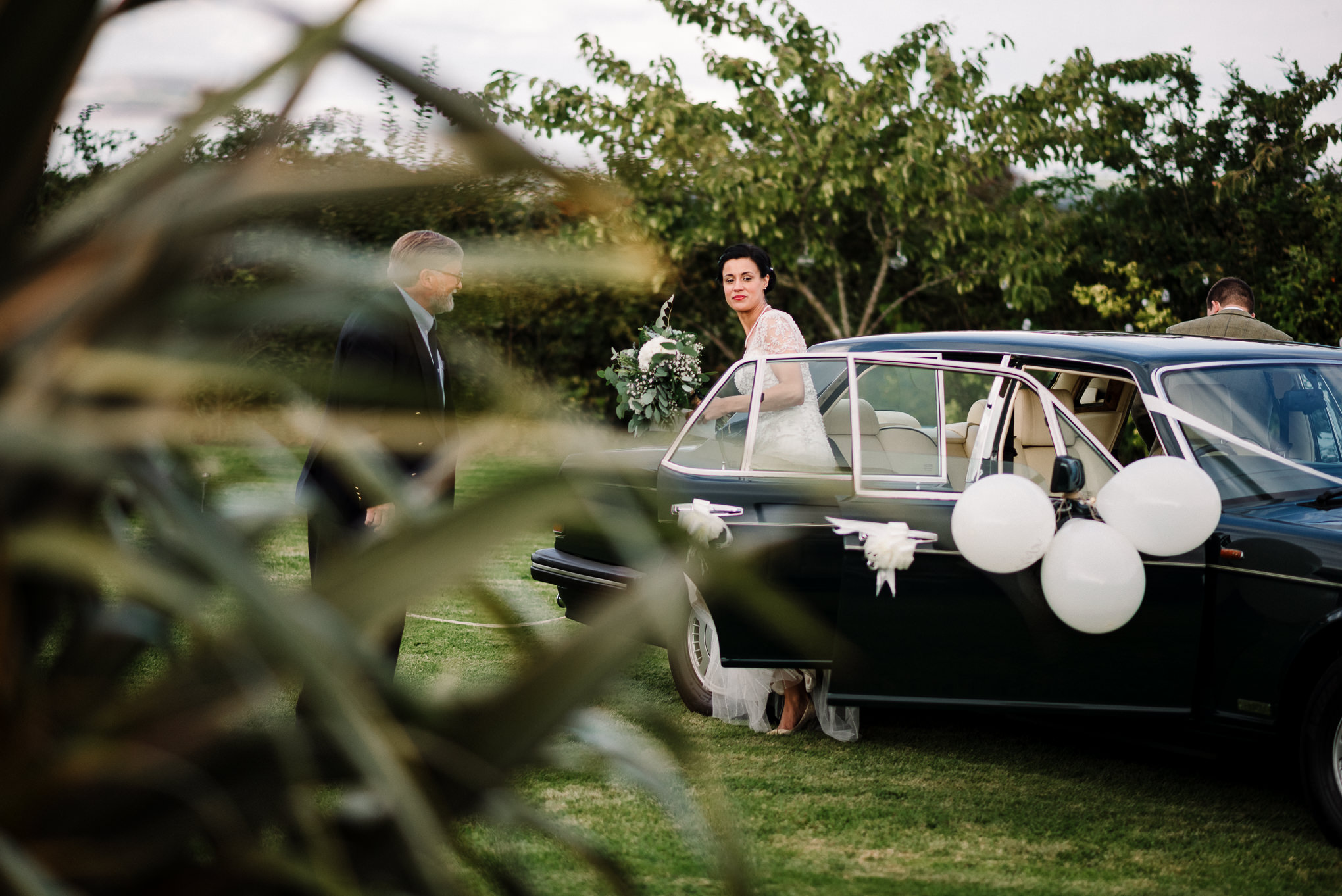 Bride and groom arriving at their farm wedding. Lake District wedding photography