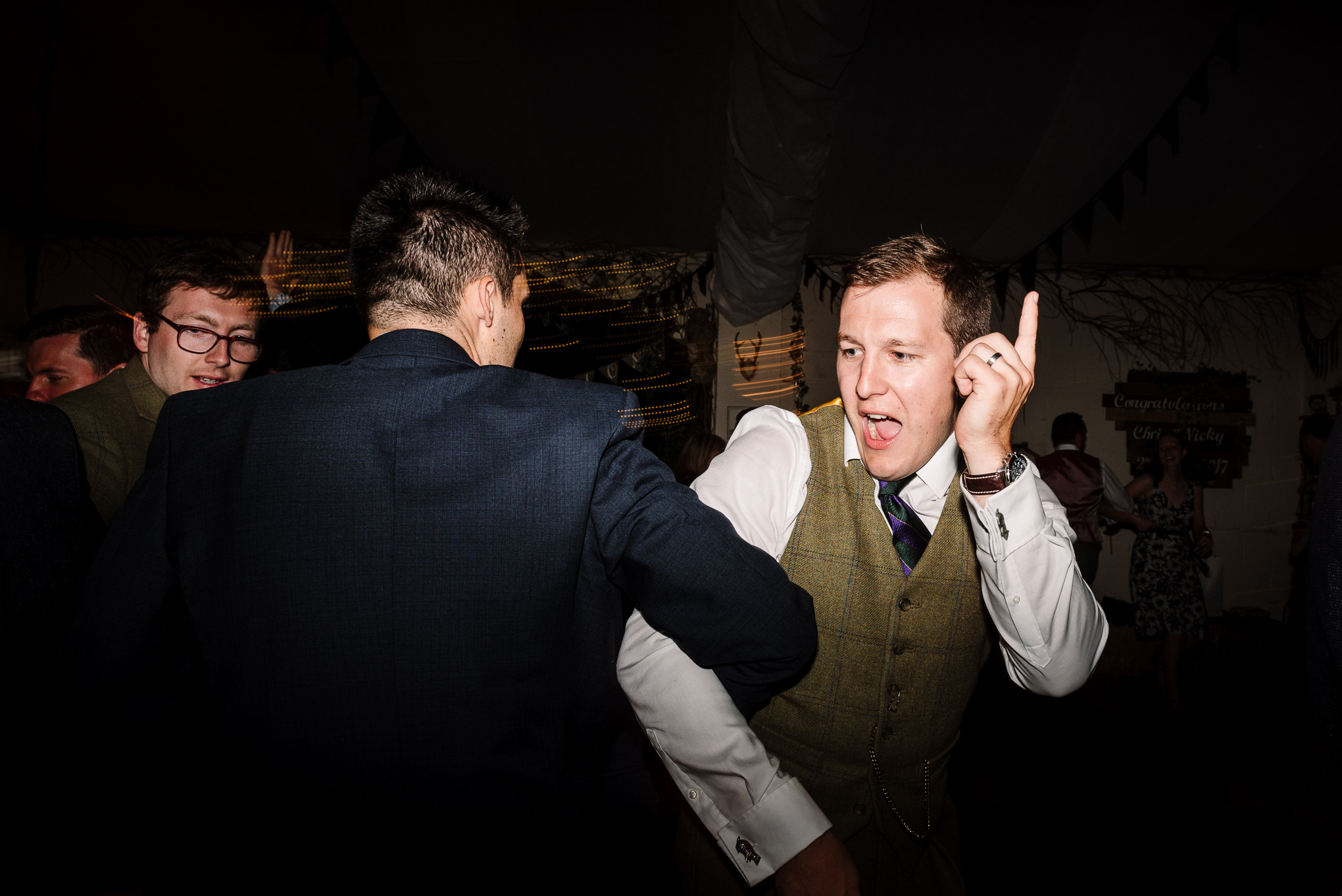 Groom on dance floor. Fun wedding photography