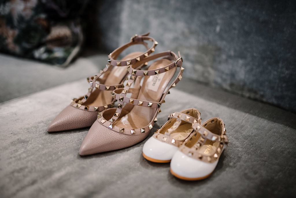 Brides Valentino wedding shoes next to daughters. Lancashire wedding photography
