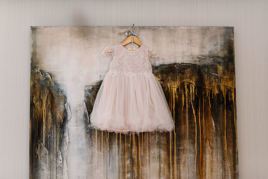 Fower girls dress hung on a picture frame
