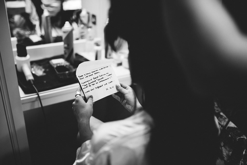 Black and white photo of a note from the groom