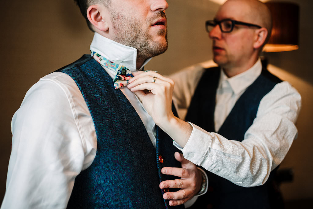 Natural shot of groomsmen getting ready at Stanley House Hotel