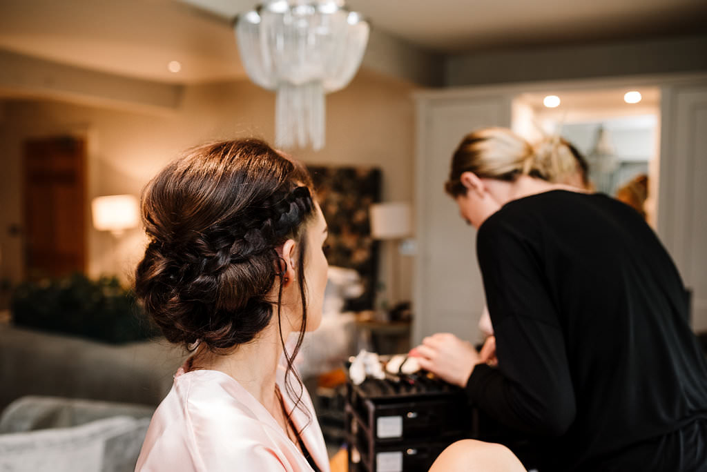 detailed shot of bridesmaids stylish hairstyle braid. Stanley House hotel wedding photography