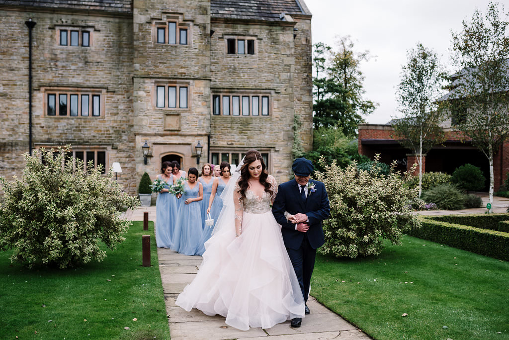 Bride walking to wedding ceremony with her Dad at Stanley House Hotel. Lancashire wedding photography