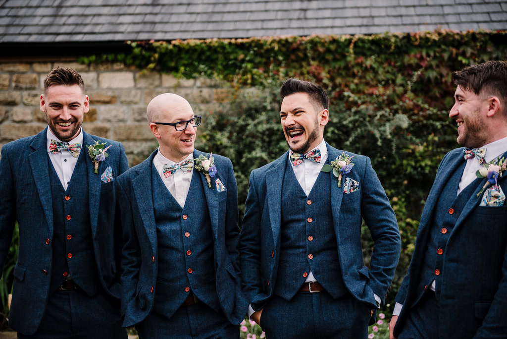 groomsmen walking together outside Stanley House. Ribble Valley wedding photography