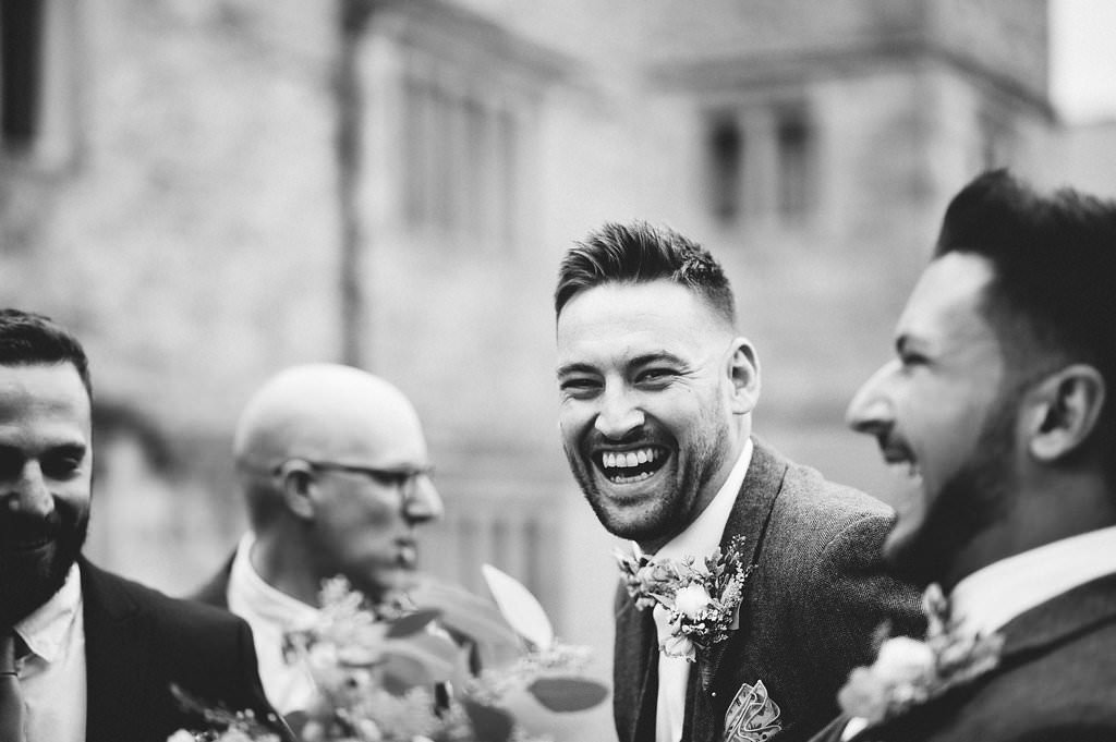 Natural shot of best man laughing. Lancashire wedding photography