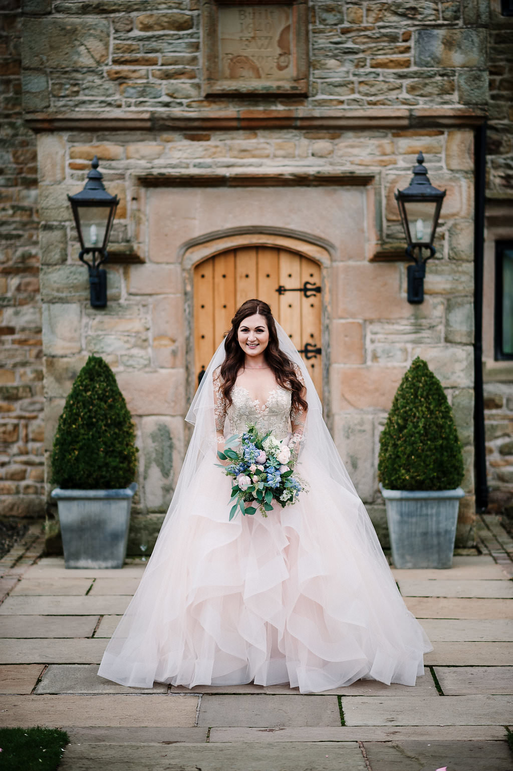 Bride stood in front of Stanley House in her Hayley Paige wedding dress. Lancashire wedding photography