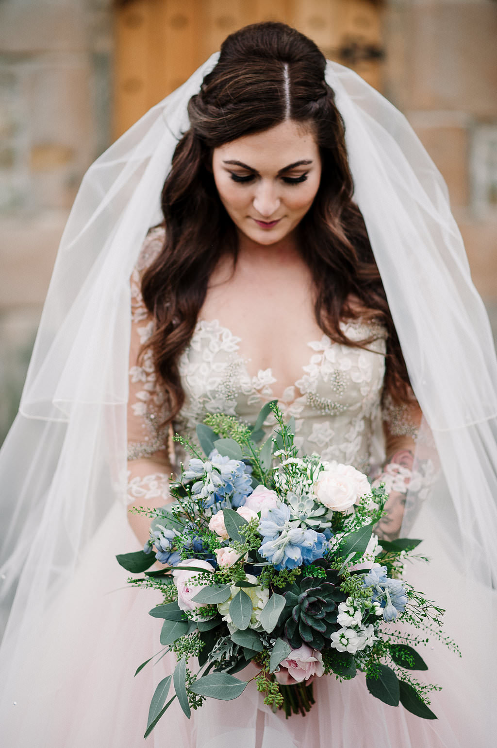 Detailed photo of wedding dress and flowers. Ribble Valley wedding