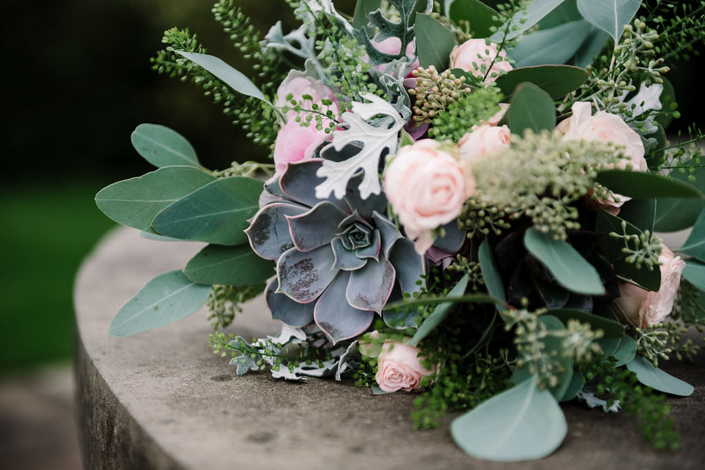Close up of brides bouquet with succulents. Modern wedding photography Lancashire
