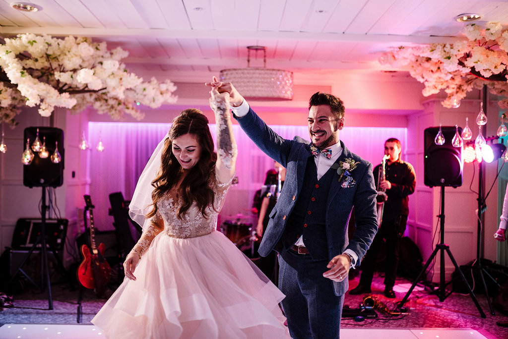 Colourful photo of bride and groom having their first dance together. Stanley house hotel.