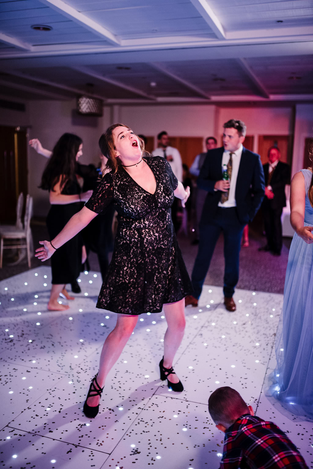Fun photo of guest dancing. Stanley house wedding photography