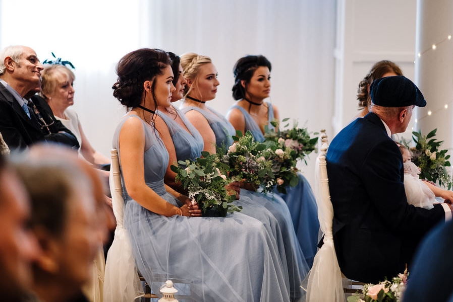 Natural photograph of the Bridesmaids during wedding service