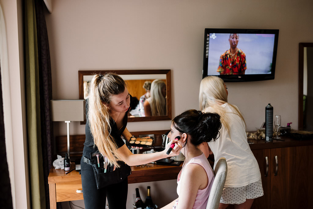 bridesmaid having her makeup done