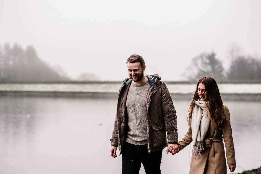 Couple walking together at Entwistle Res, Bolton. 