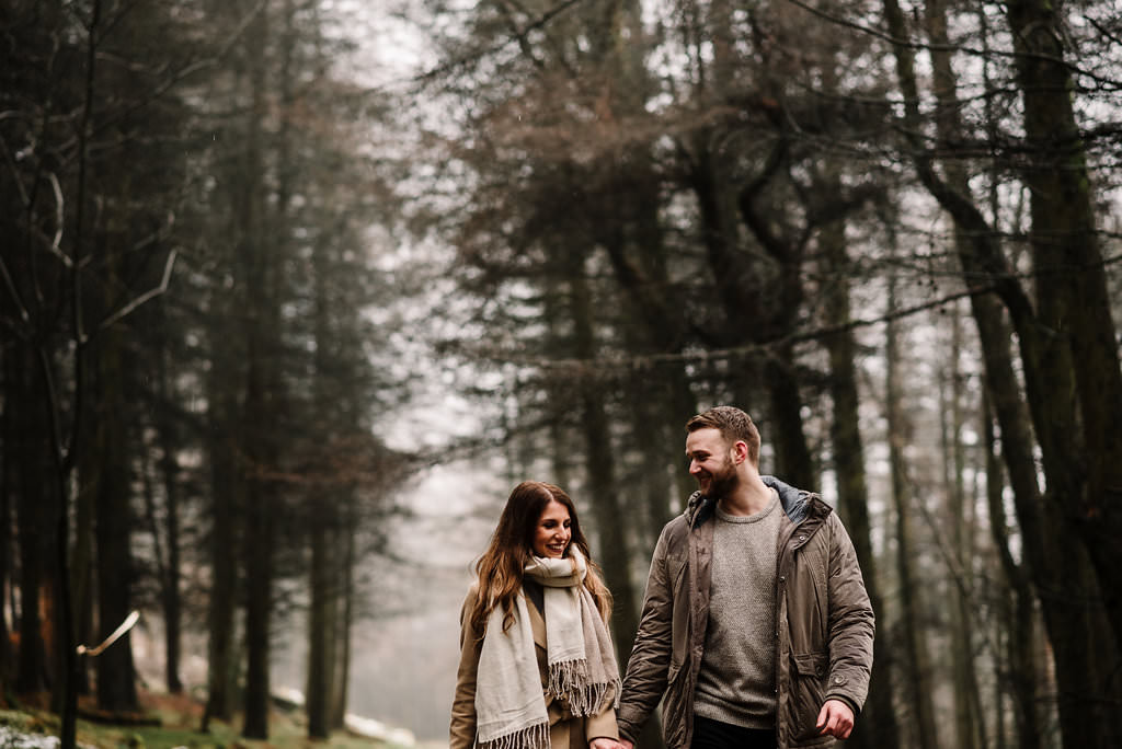 Relaxed photo of couple together in the woods 