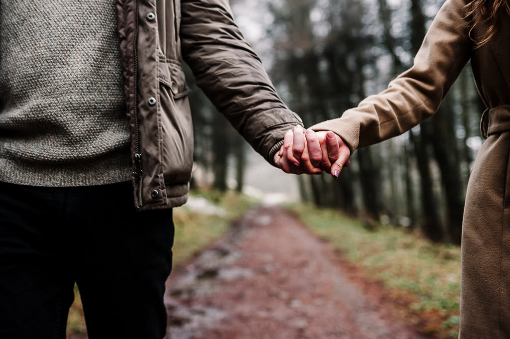 Close up of couple holding hands