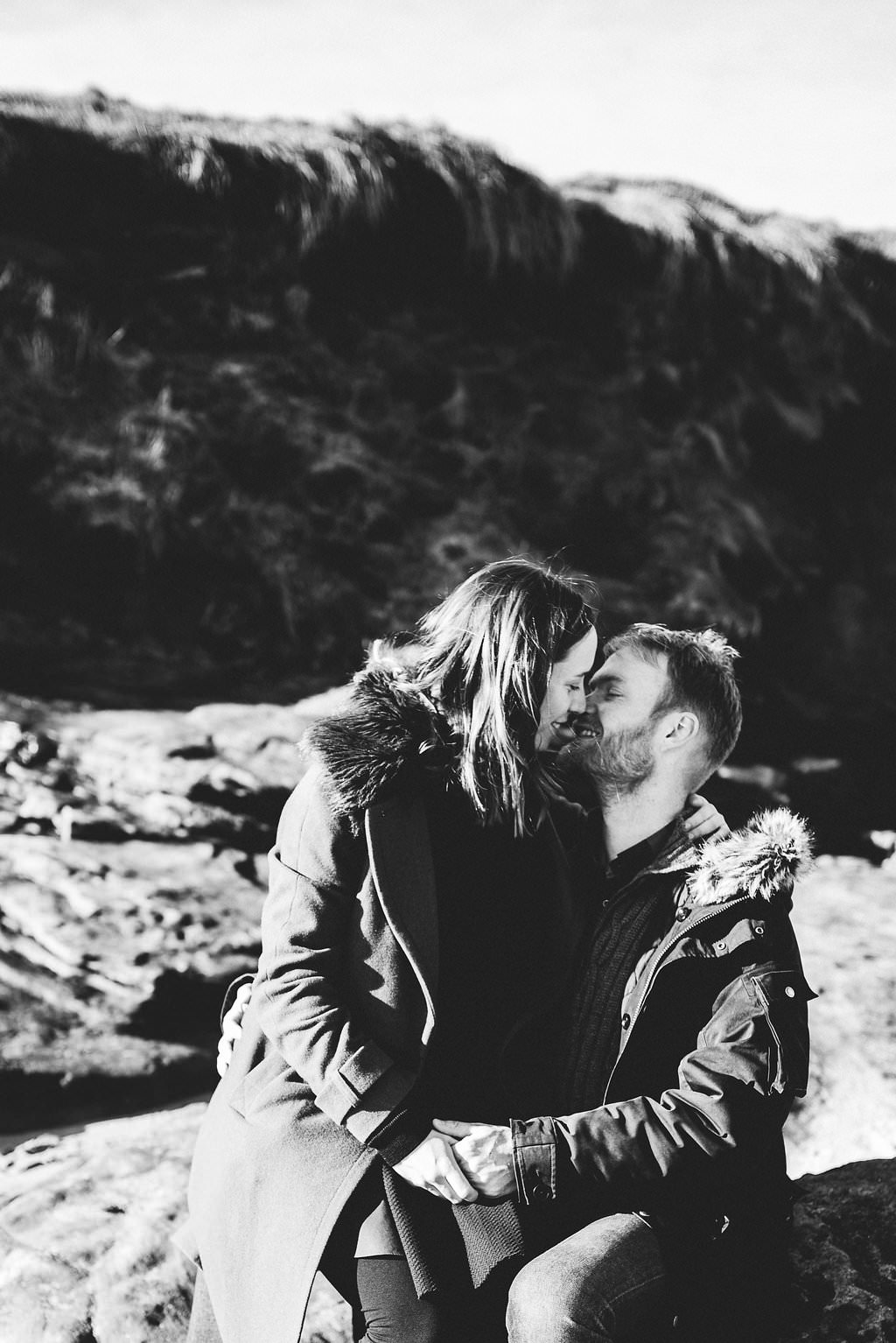 black and white intimate photo of couple kissing. Engagement photography West Kirby