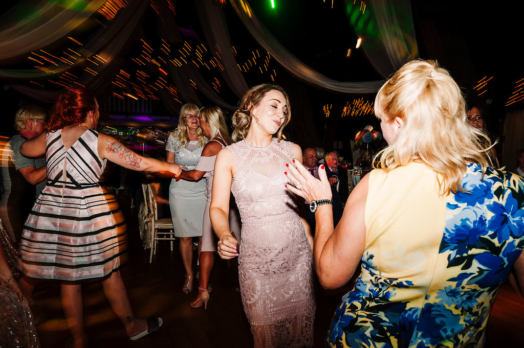 Natural photo of guests dancing 