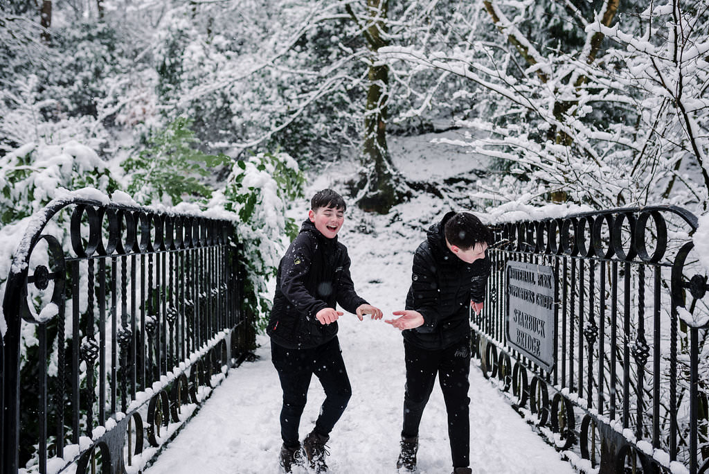 Fun photo of kids playing in the snow. Lancashire photography