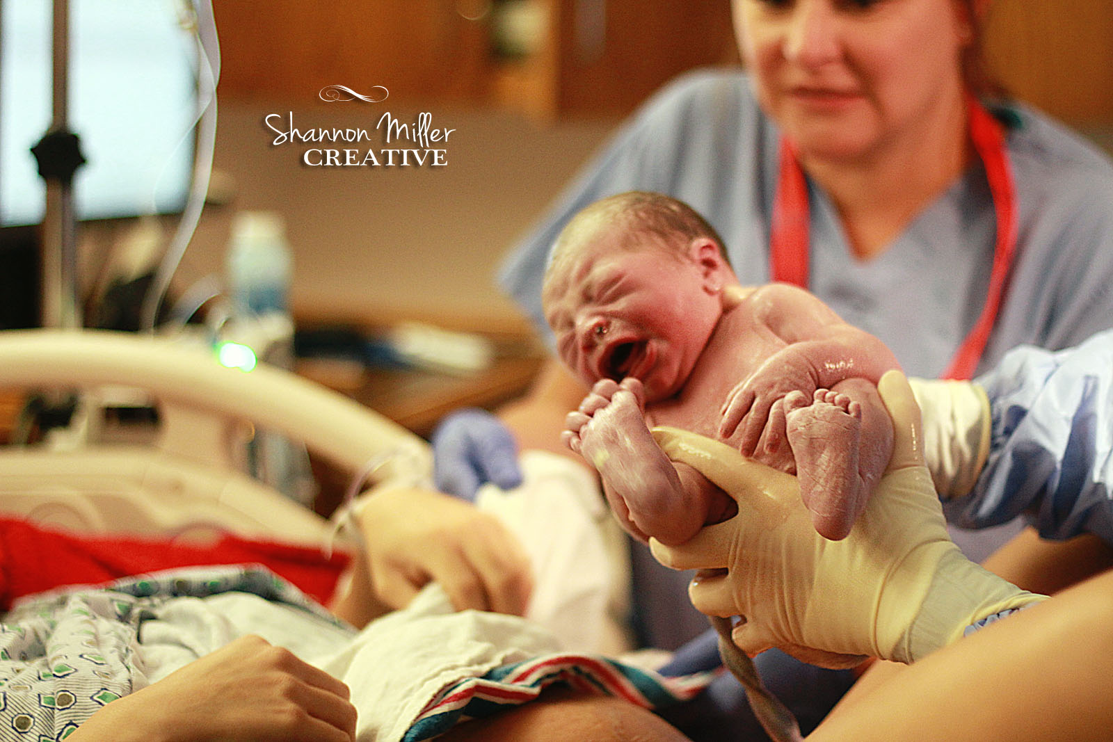 First moments as baby Landon enters the world and is hoisted up on Bianca's belly