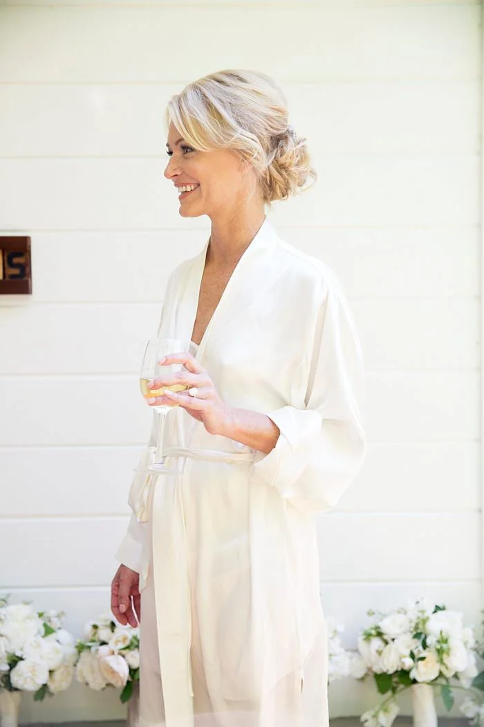 www.santabarbarawedding.com | Kristen Beinke | San Ysidro Ranch | Alexandra Kolendrianos | Shine Blow Dry Bar Montecito | Bride Drinks Wine Before the Ceremony