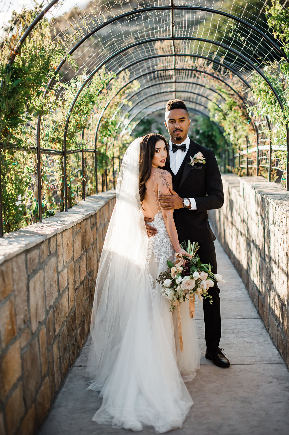 www.santabarbarawedding.com | The Tavern at Zaca Creek | Events by Fran | Michelle Ramirez Photography | Tangled Lotus | Friar Tux | Ever After Bridal | EmmaLinh | Bride and Groom Under Arch