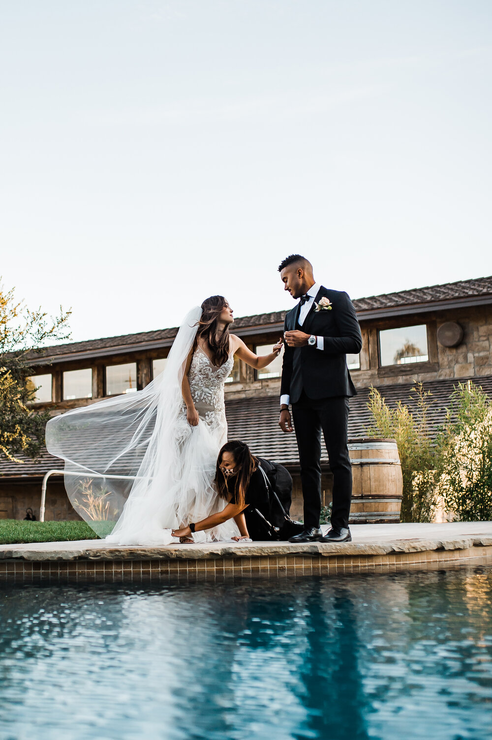 www.santabarbarawedding.com | The Tavern at Zaca Creek | Events by Fran | Michelle Ramirez Photography | Tangled Lotus | Friar Tux | Ever After Bridal | Vendor Fixing Model’s Gown