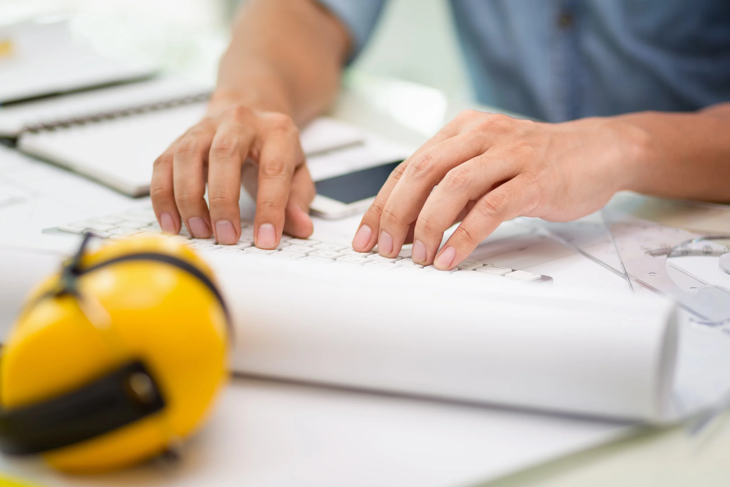 stock-photo-working-group-three-young-architects-working-on-a-project-at-a-table-in-the-study-236721541.jpg