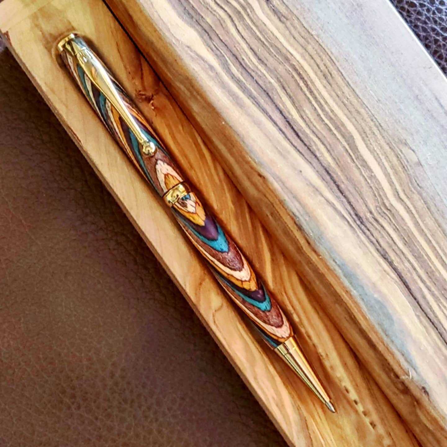 Jadon's pen up close! Sitting in a new olivewood desk accessory!

This 7-year-old just made a pen with zero &quot;hands on&quot; help! Already loaded with Fisher Space ink and sold! 
.
.
#jadonroland #woodnotch #woodnotchpens #woodworking #youngentre