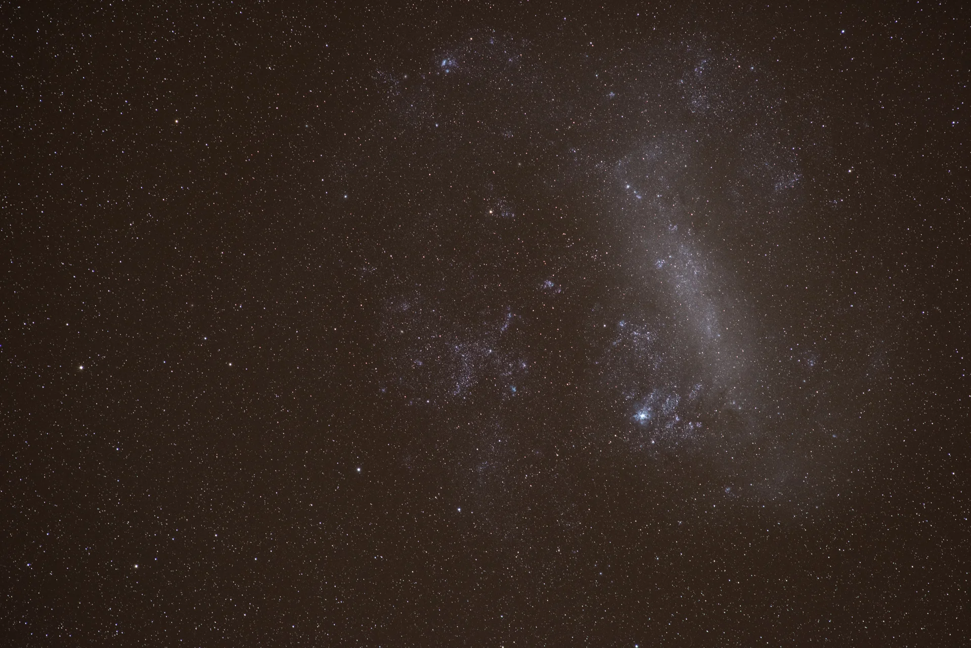 A straight out of camera single long exposure of the Large Magellanic Cloud through my 180mm f/2.8 Nikkor lens! Using a German Equatorial Mount I was able to track the sky and shoot about an hour of total exposure time on the LMC- hoping to combine 