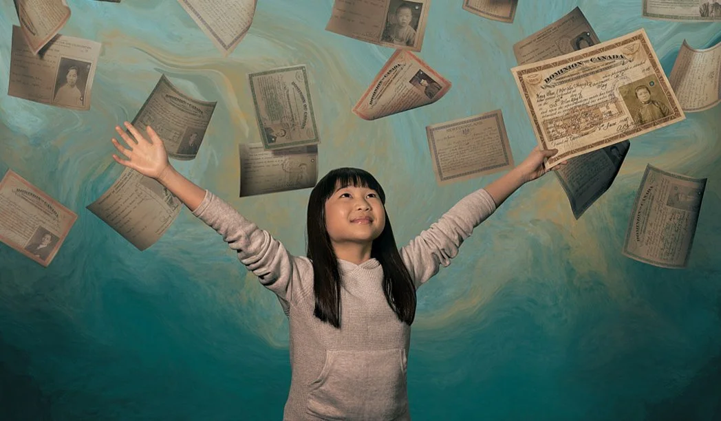 Advertising photographer London campaign image for out-of-home commercial lifestyle campaign of Chinese girl with hands in air and historic Head Tax certificates overhead on turquoise painted background.