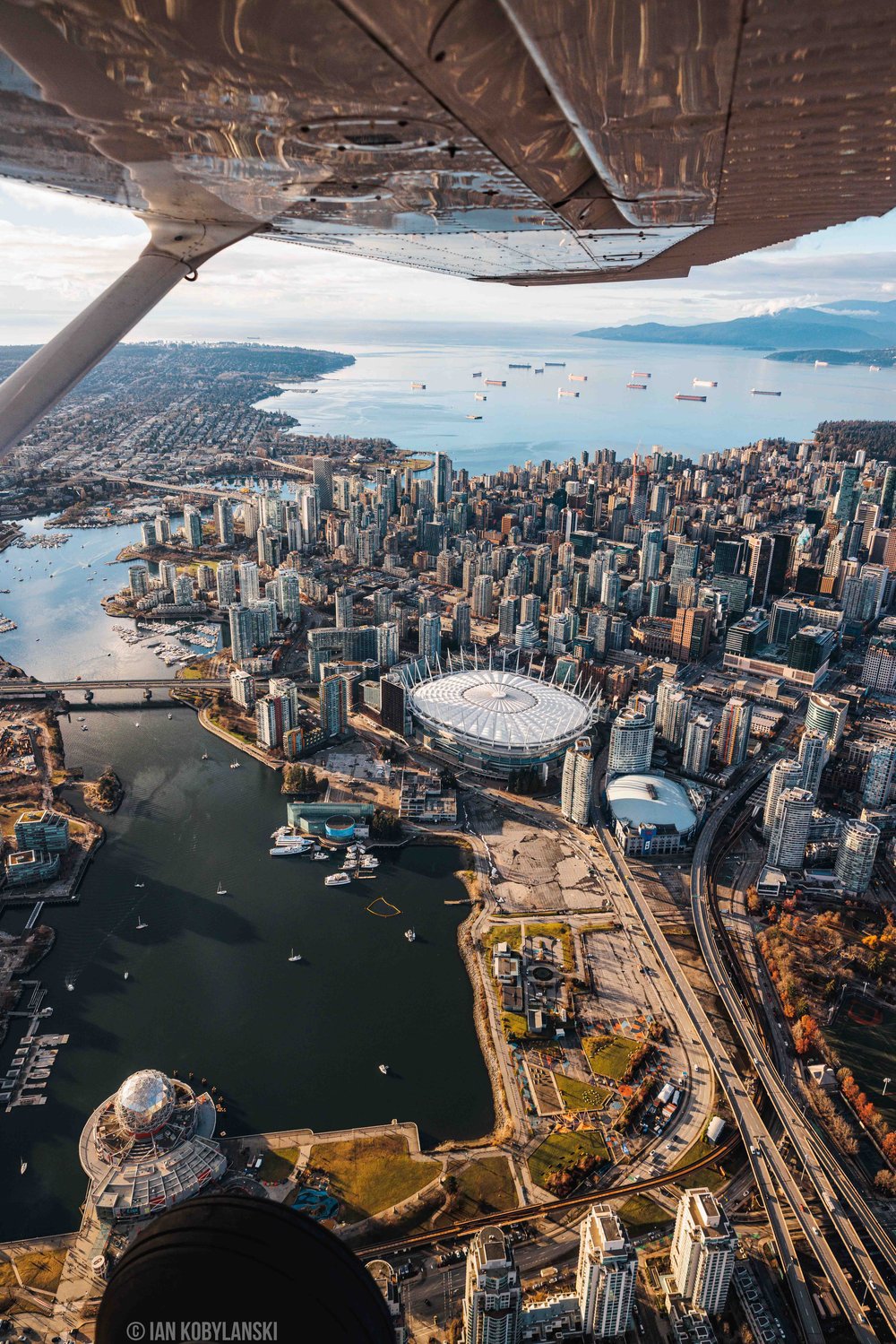  False Creek with B.C. Place, Rogers Arena, and Science World captured vertically out of our airplane window. 