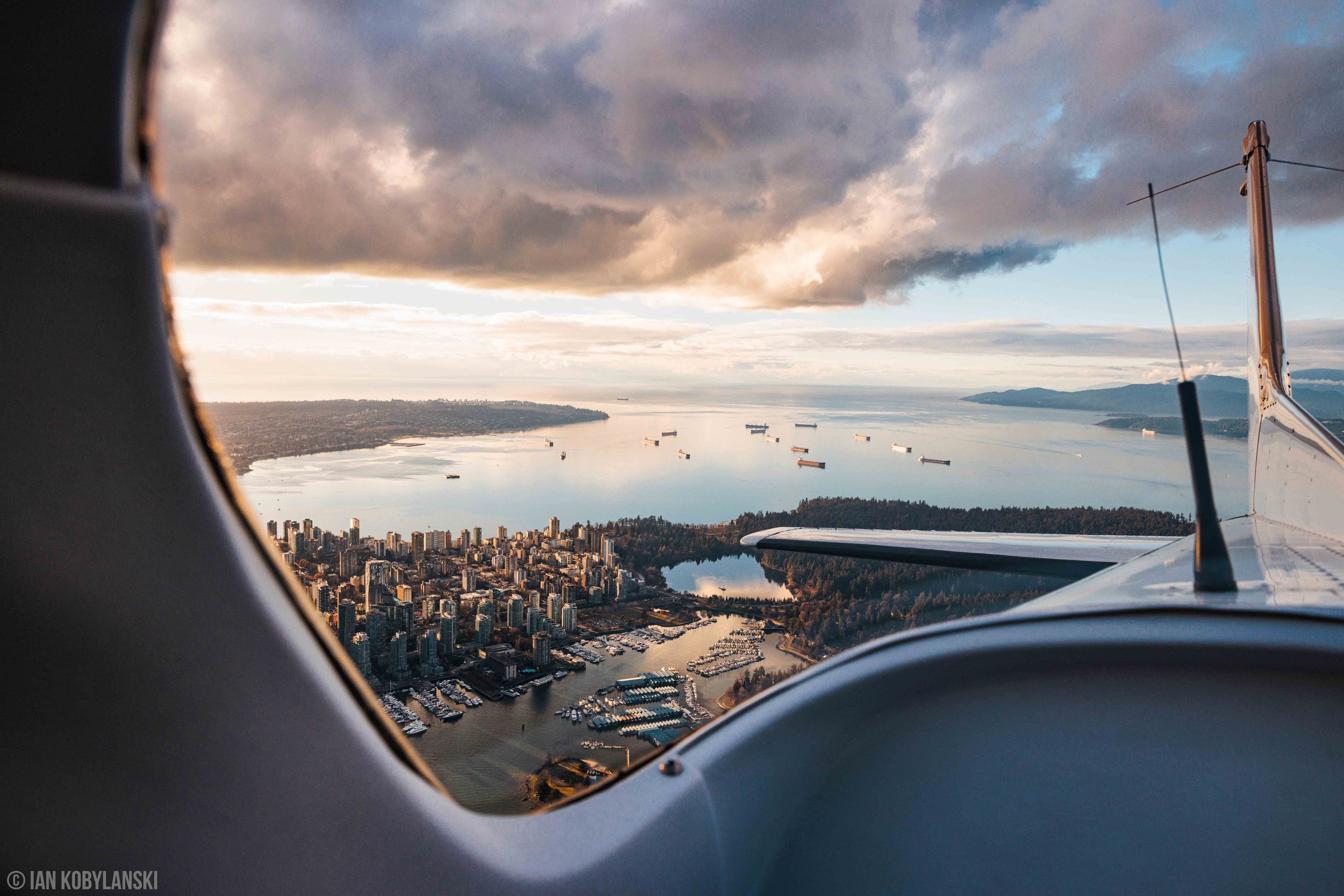   "Home Sweet Home” . Stanley Park and the Coal Harbour skyline from the rear window of an airplane.  Available as a fine art print here . 