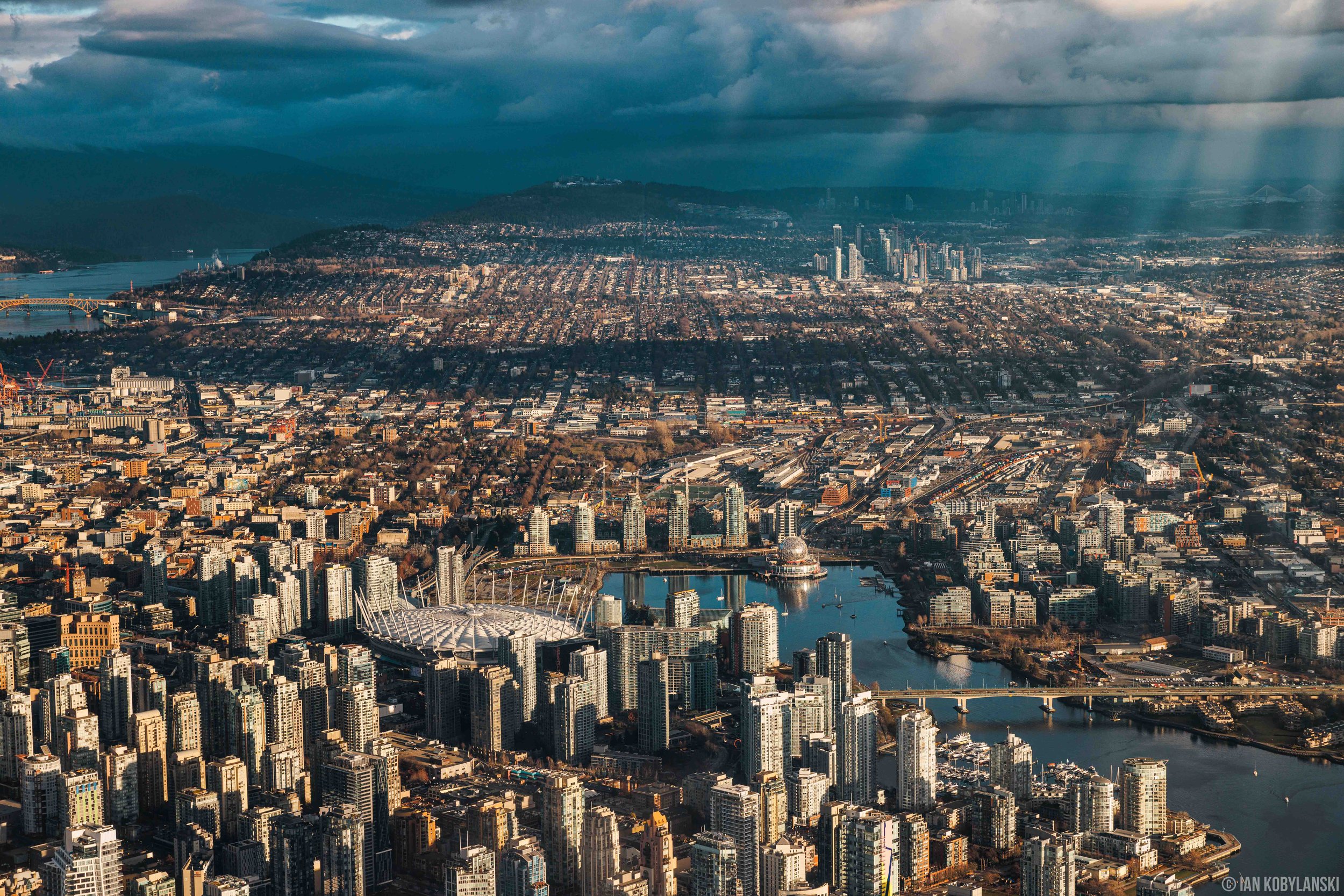   “East Vancouver Skyline”.  The place I call home. Spanning from False Creek with Science World and B.C. Place Stadium, Mount Pleasant, Commercial Drive, and beyond, this 2023 image captures all of East Vancouver. The visibility includes Iron Worker