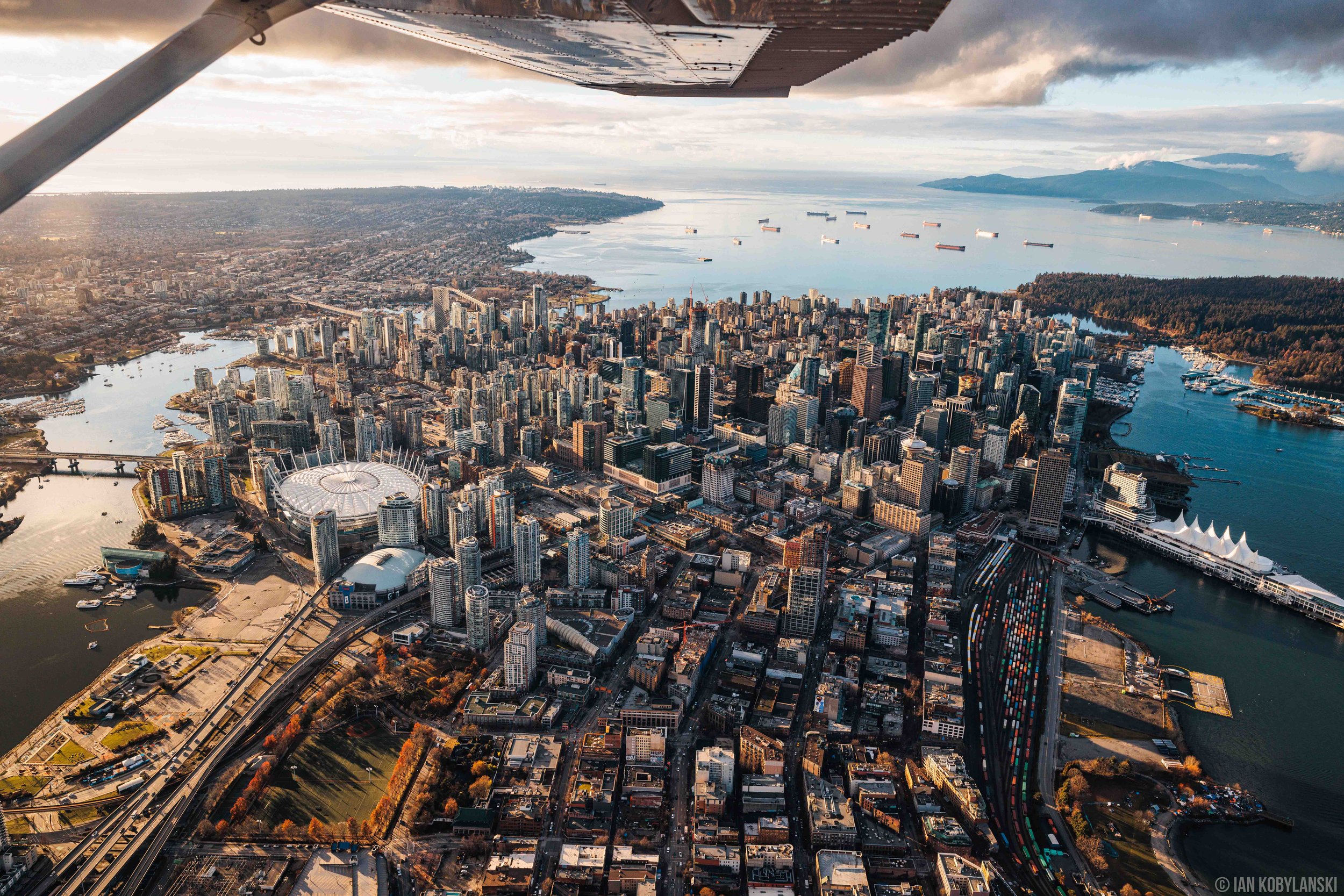  Vancouver, B.C.’s downtown core including Gastown and Chinatown town centred in the middle. This image stretches from North to South, with False Creek on the left, the three main downtown bridges, and the waters beyond. 