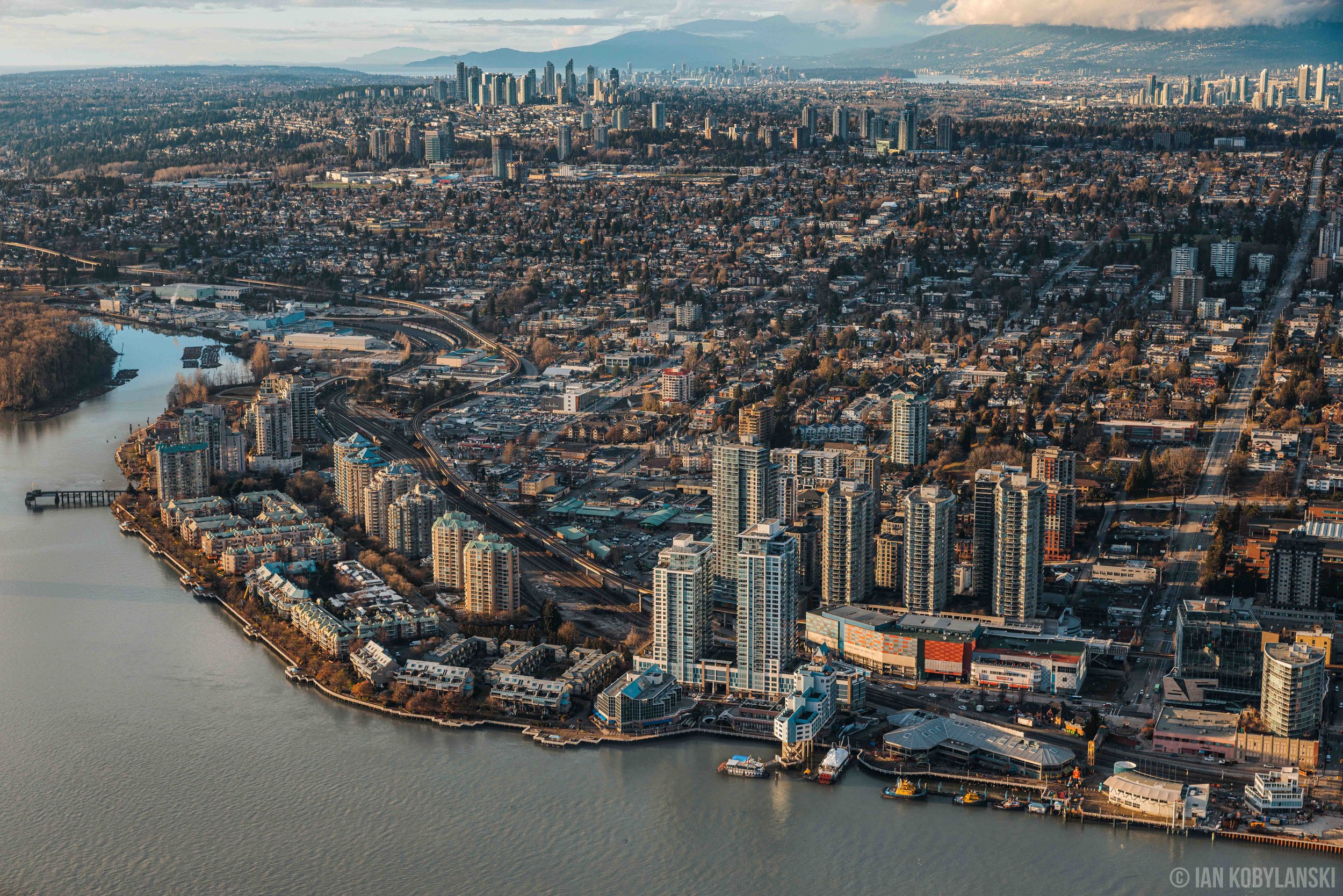   “New Westminster Skyline” . Where I was born. This aerial view of New Westminster from 2023 captures the waters and piers of the New Westminster Quay, the whole length of Eighth Street, and visibility to Surrey, Burnaby, the downtown Vancouver skyl