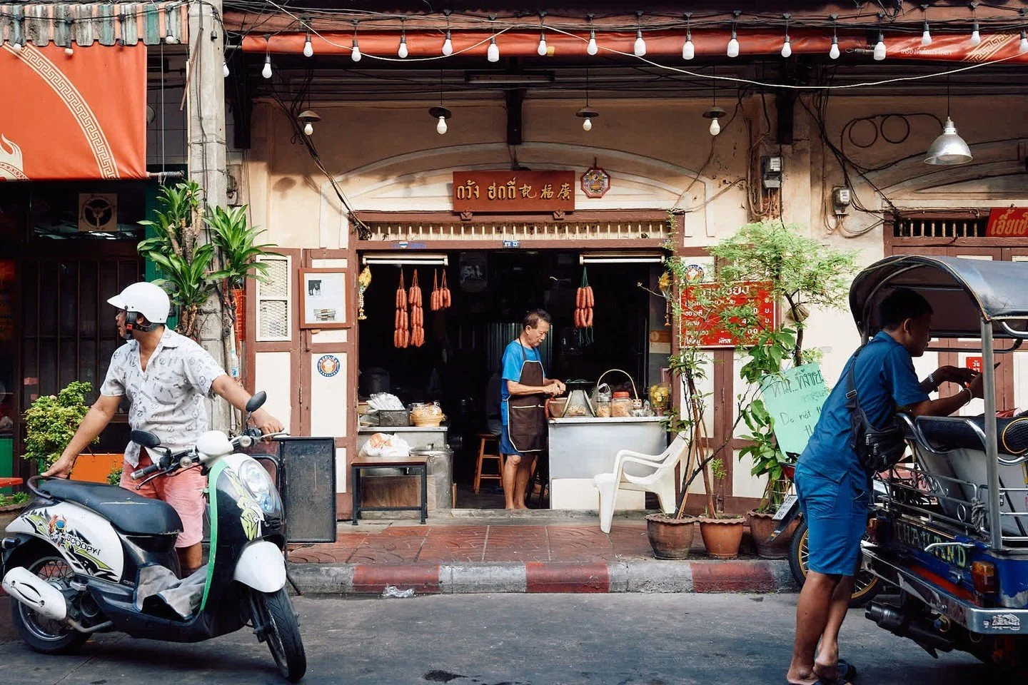 A working day in Bangkok, Thailand

1. Sausage man
2. Recycling bags
3. Ice man
4, Key man
5. Waiting on customers
6. Sweeping in the sun
7. Construction carpool
8. Misting produce
9. Setting up New Years' displays
10. Hanging lanterns

Bangkok is a 